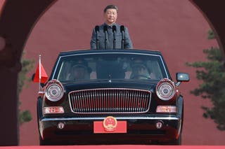 Chinese president Xi Jinping is ready to review troops as a Hongqi limousine carrying him